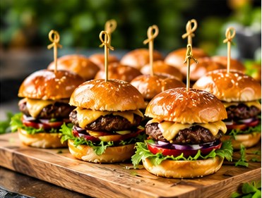 Mini cheeseburger sliders on a wooden board